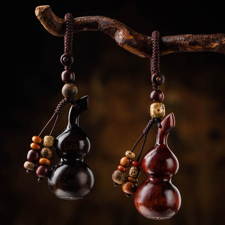 Schlüsselanhänger aus tibetischem Ebenholz, kleinem Blatt, rotem Sandelholz, Kürbis, Glücksschutz