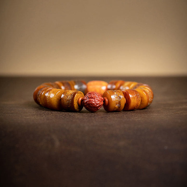 Buddha Stones Tibetisches natürliches Kamelknochen-Bernstein-Roter Achat-Türkis-Schutz-Glücksarmband