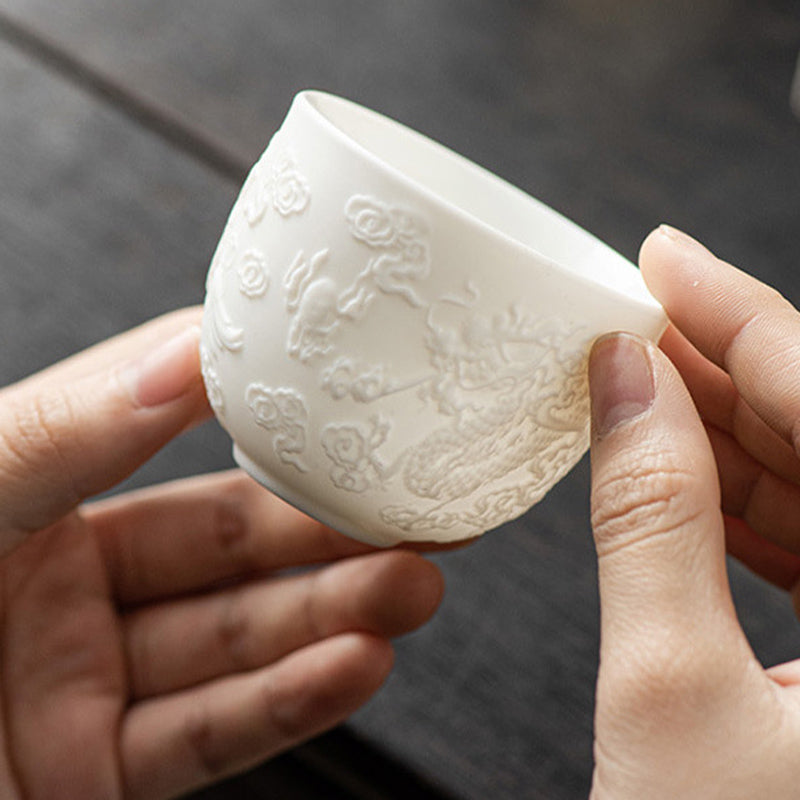 Buddha Stones Dragon Phoenix Relief Weiß Porzellan-Keramik-Teetasse Kung-Fu-Teetasse 115 ml