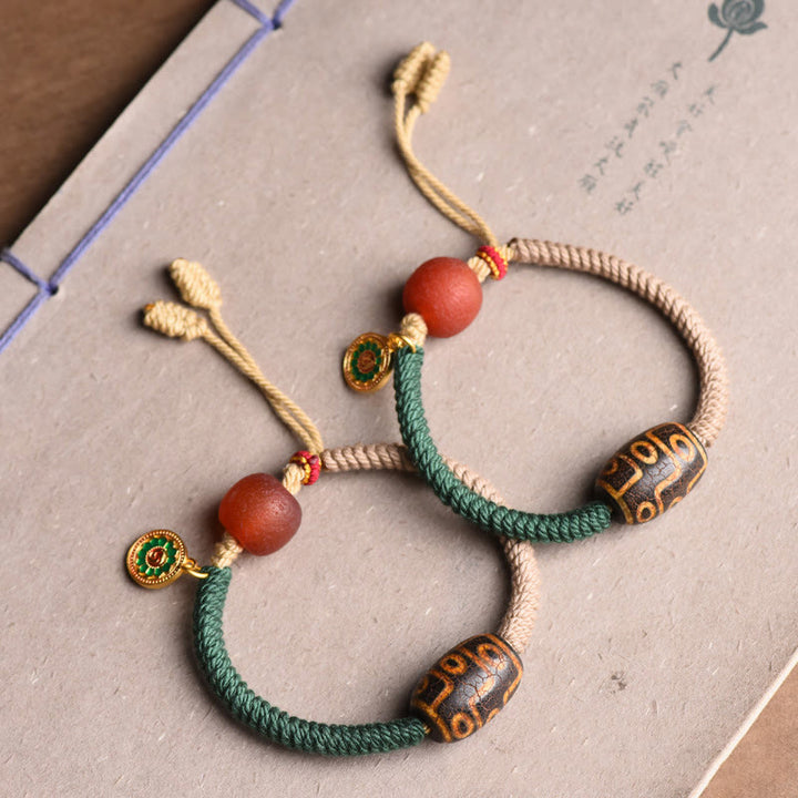 Buddha Stones Handgefertigtes tibetisches Neun-Augen-Dzi-Perlen-Armband