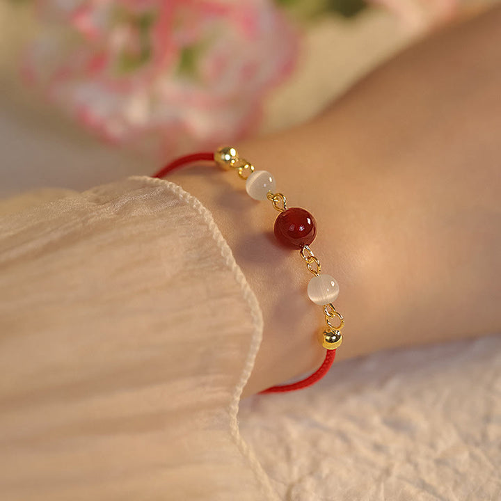 Buddha Stones Rotes Achat-Katzenaugen-Armband mit geflochtener Schnur