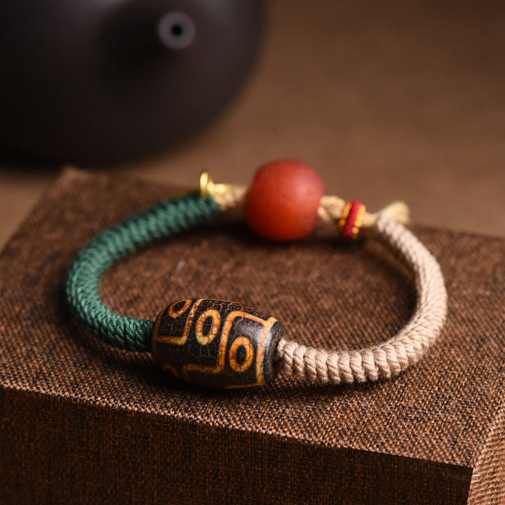 Buddha Stones Handgefertigtes tibetisches Neun-Augen-Dzi-Perlen-Armband