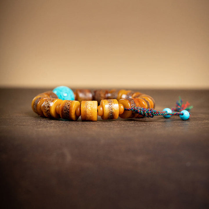 Buddha Stones Tibetisches natürliches Kamelknochen-Bernstein-Roter Achat-Türkis-Schutz-Glücksarmband