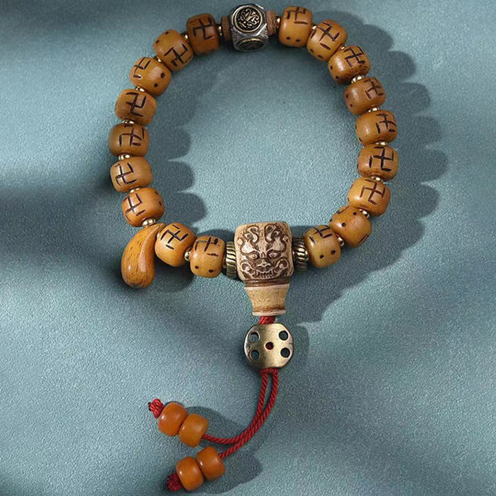 Buddha Stones, natürliches tibetisches Kamelknochen-Hakenkreuz-Dzi-Perle, Shankha-Buddha-Charm, Kirtimukha-Glücksschutz-Quastenarmband