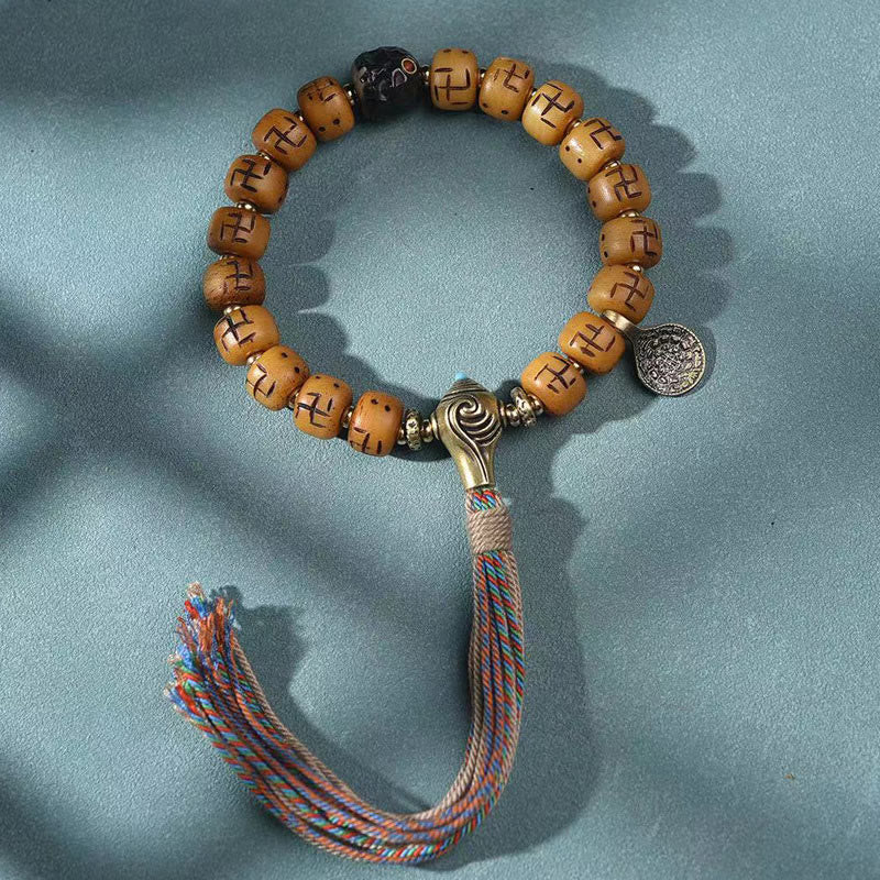 Buddha Stones, natürliches tibetisches Kamelknochen-Hakenkreuz-Dzi-Perle, Shankha-Buddha-Charm, Kirtimukha-Glücksschutz-Quastenarmband