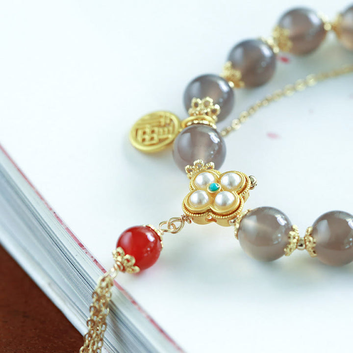 Buddha Stones natürliches graues Achat-Fu-Charakter-Perlen-Quasten-Balance-Armband