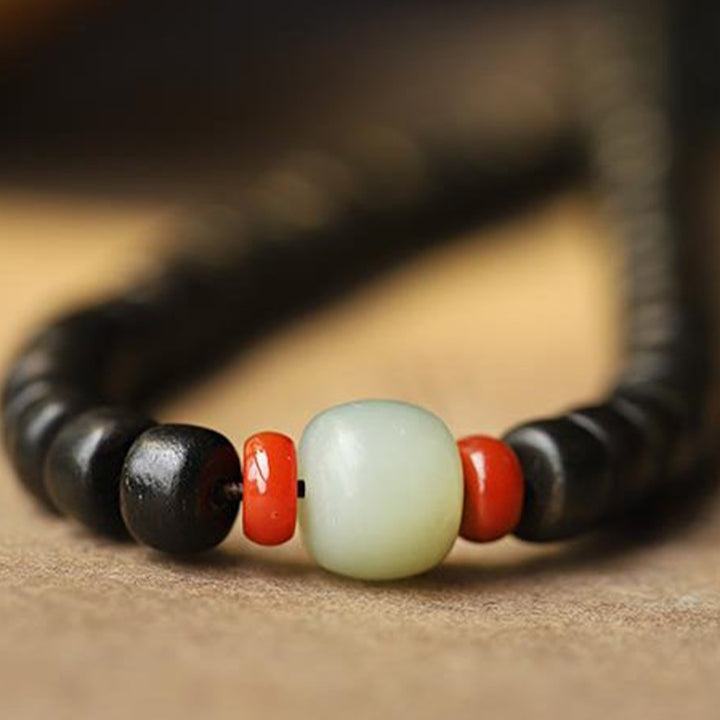 Armband mit 108 Mala-Perlen, Adlerholz, Jade, Stärke, Ruhe