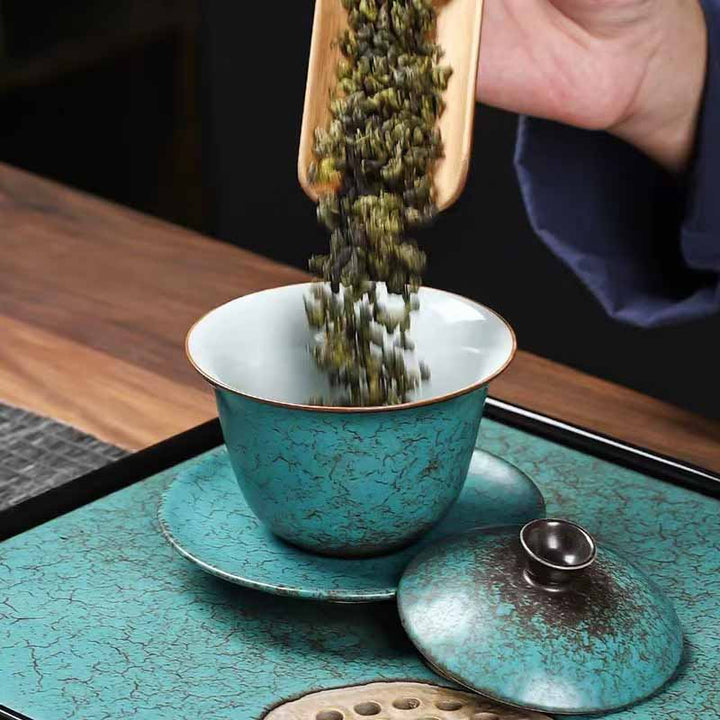 Buddha Stones Traditionelle Kiefernbaum grüne Keramik Gaiwan Sancai Teetasse Kung Fu Teetasse und Untertasse mit Deckel