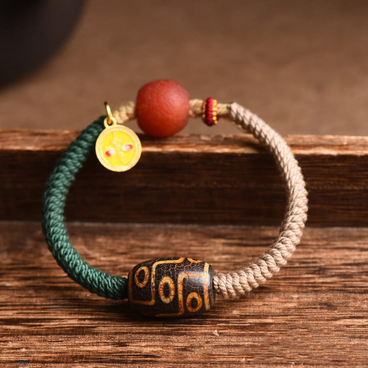 Buddha Stones Handgefertigtes tibetisches Neun-Augen-Dzi-Perlen-Armband