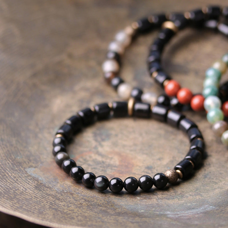 Armband mit Buddha Stonesn, Ebenholz, rotem Jaspis, Moos-Achat, Kristall, Kupfer, Friedenspaar