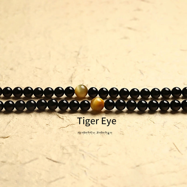 Tibetisches Schutzarmband mit 108 Mala-Perlen, schwarzem Onyx, dreiäugigen Dzi-Perlen
