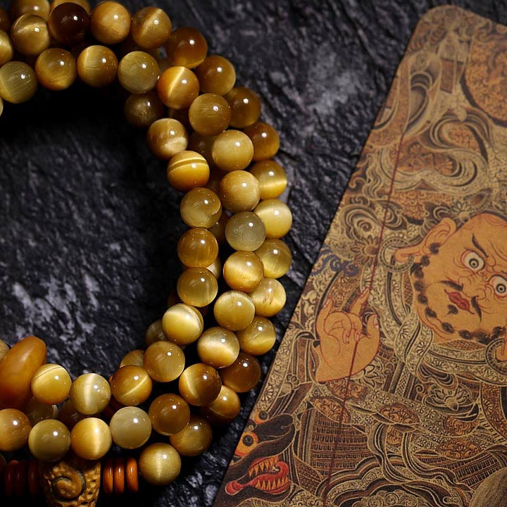 Buddha Stones 108 Mala Perlen Natürliches Tigerauge Kupfer Dorje Schutz Quastenarmband