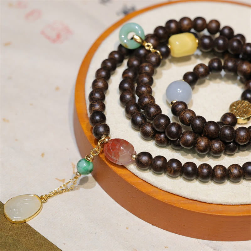 Buddha Stones 108 Mala Perlen Brunei Agarwood Bernstein Roter Achat Friedensschnalle Jade Friedensarmband