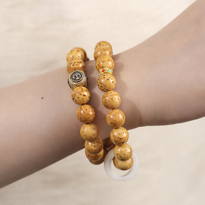 Buddha Stones, tibetisches Natur-Lila-Gold-Ratten-Bodhi-Samen-Reichtum, doppelt gewickeltes Armband