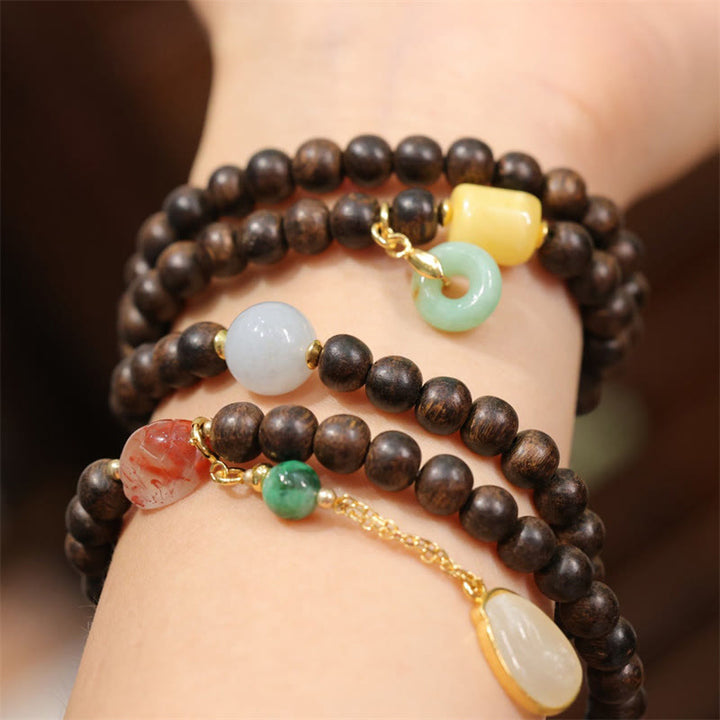 Buddha Stones 108 Mala Perlen Brunei Agarwood Bernstein Roter Achat Friedensschnalle Jade Friedensarmband