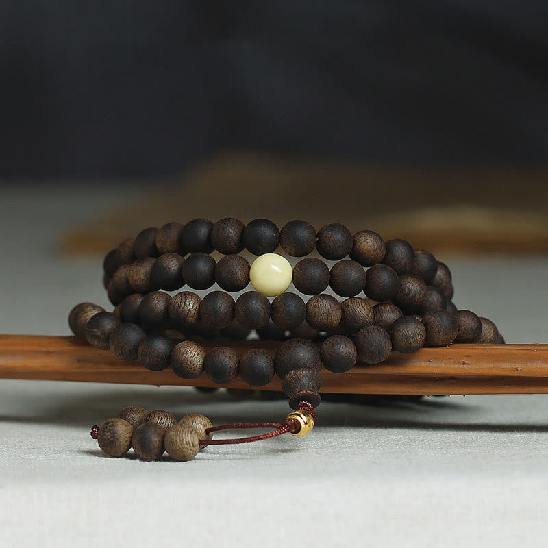 Buddha Stones 999 Gold Tarakan 108 Mala Perlen Adlerholz Bernstein Armband zur Abwehr böser Geister