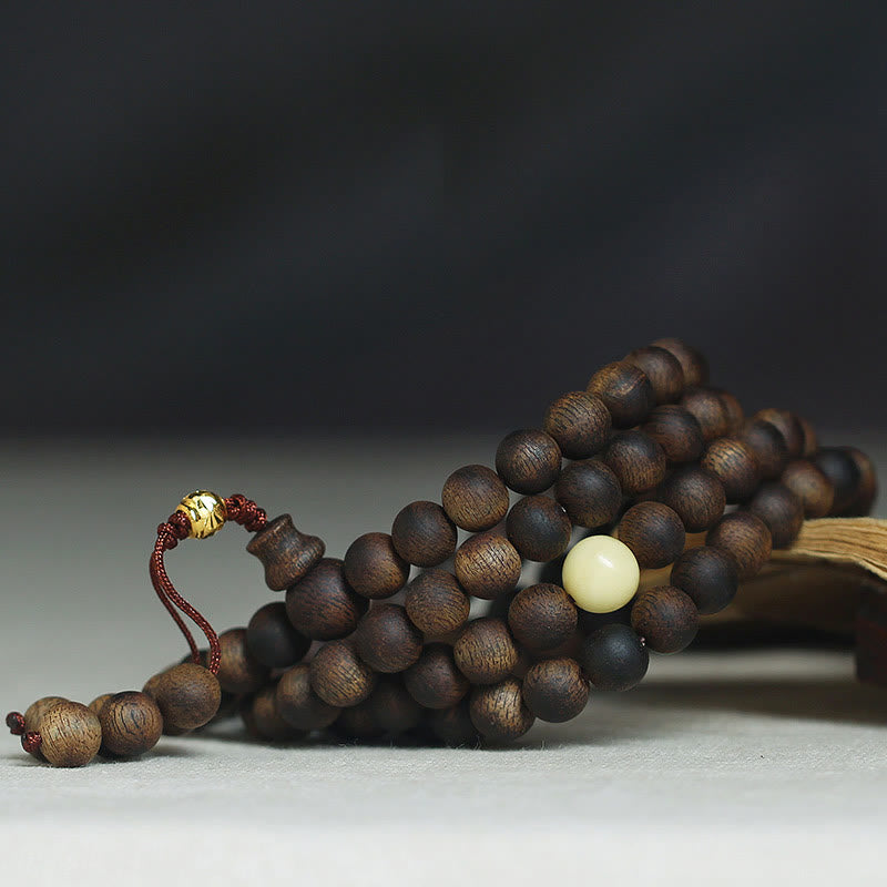 Buddha Stones 999 Gold Tarakan 108 Mala Perlen Adlerholz Bernstein Armband zur Abwehr böser Geister