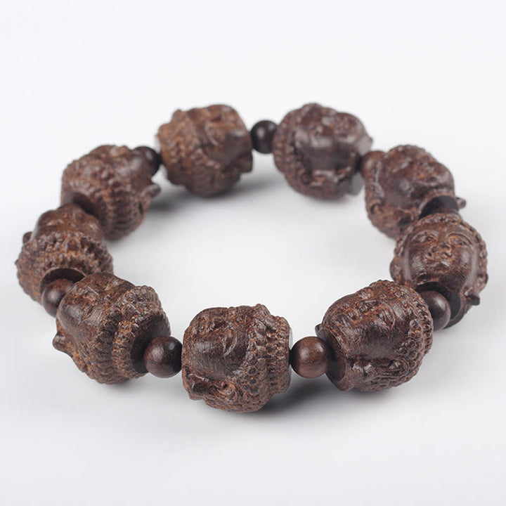 Buddha Stones Agarwood Buddha geschnitztes ruhiges Armband